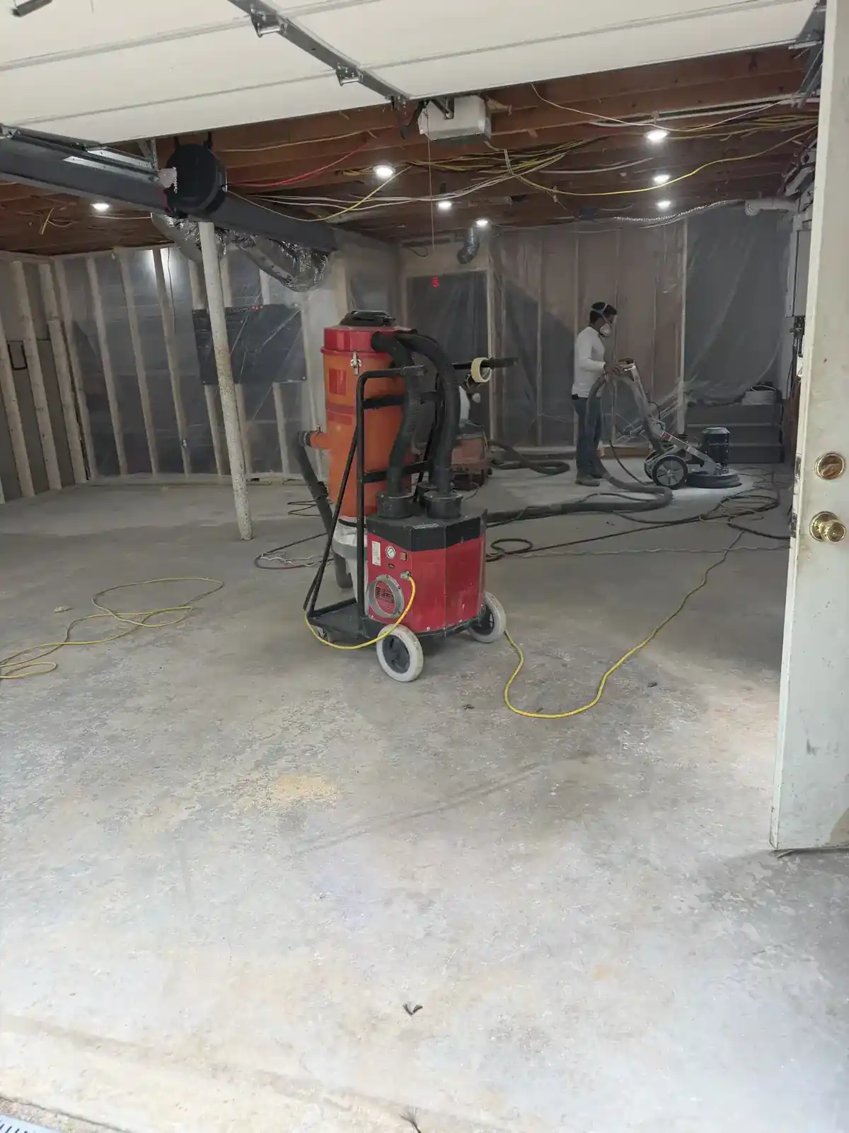 Concrete surface grinding during floor preparation