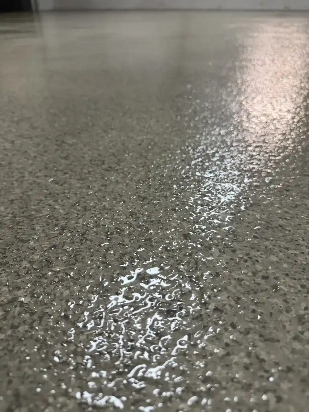 Topcoat application detail on flake floor