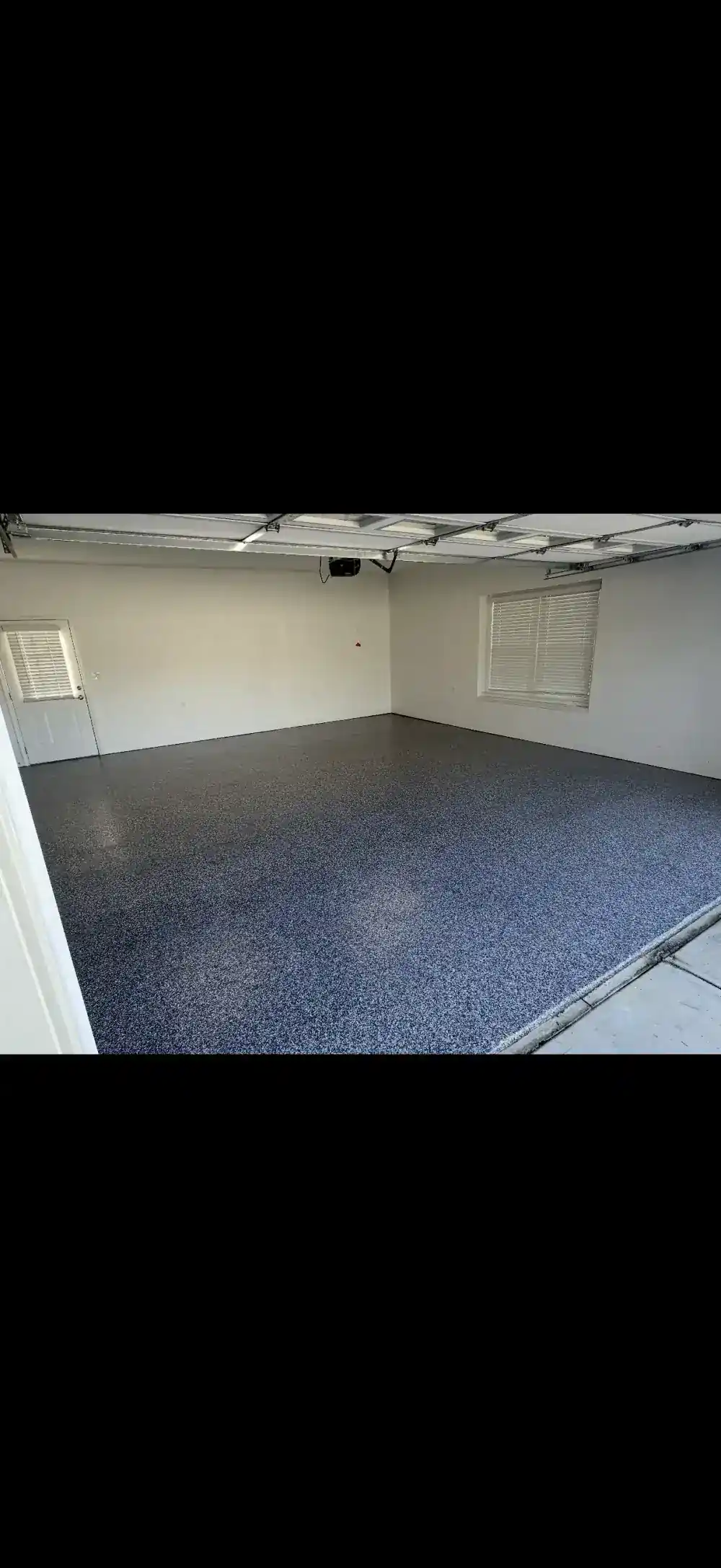 Finished residential garage floor, blue and gray flake